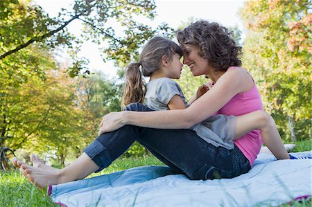 park picnic - Mother and daughter relaxing on blanket Stock Photo - Premium Royalty-Free, Code: 649-05819855