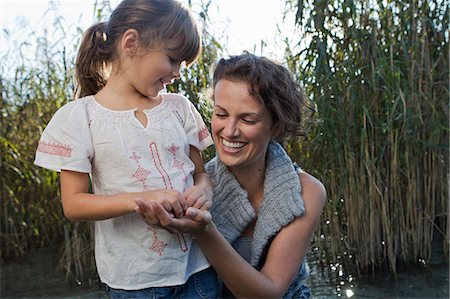 elementary age - Mother and daughter talking in pond Stock Photo - Premium Royalty-Free, Code: 649-05819868