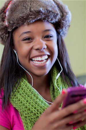 fur - Teenage girl listening to headphones Stock Photo - Premium Royalty-Free, Code: 649-05819945