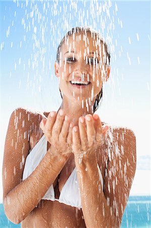 pretty smiling portrait - Woman splashing in swimming pool Stock Photo - Premium Royalty-Free, Code: 649-05820166