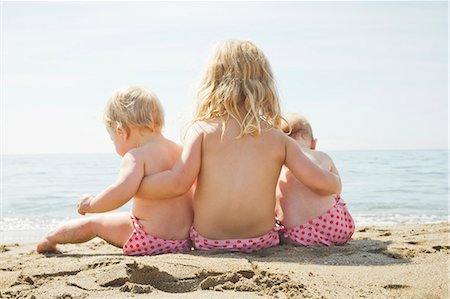 siblings at beach - Children in matching bikini bottoms Stock Photo - Premium Royalty-Free, Code: 649-05820273