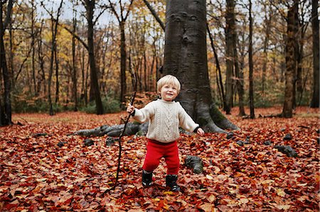 Toddler walking in autumn leaves Stock Photo - Premium Royalty-Free, Code: 649-05820466