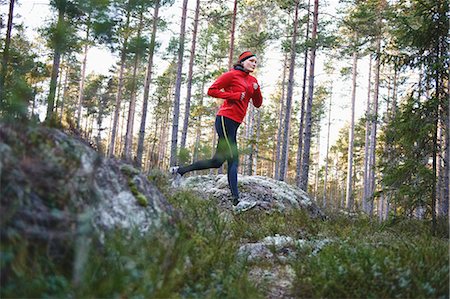 runners - Woman running in forest Stock Photo - Premium Royalty-Free, Code: 649-05820502