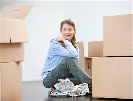 people moving boxes - Woman wrapping dishes to pack Stock Photo - Premium Royalty-Free, Code: 649-05820556