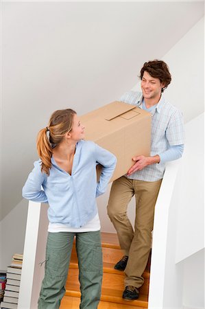 Couple carrying cardboard box Stock Photo - Premium Royalty-Free, Code: 649-05820561