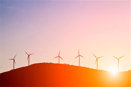 energy windmill hills - Silhouette of windmills on rural hills Stock Photo - Premium Royalty-Free, Code: 649-05821287