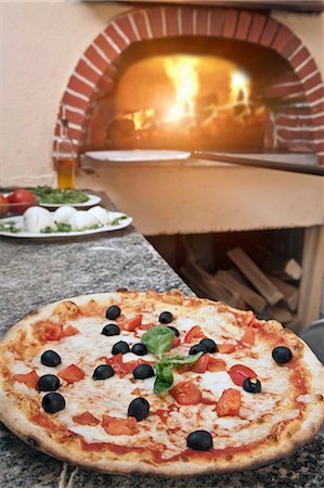 restaurant kitchen - Pizza on counter in kitchen Stock Photo - Premium Royalty-Free, Code: 649-05821482