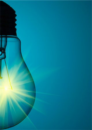 Close up of glowing light bulb Stock Photo - Premium Royalty-Free, Code: 649-05821652