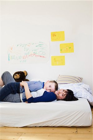 simsearch:649-03770651,k - Mother and son relaxing on bed Stock Photo - Premium Royalty-Free, Code: 649-05949788