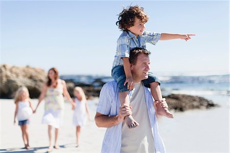 father carrying girl - Father carrying son on shoulders Stock Photo - Premium Royalty-Free, Code: 649-05950019