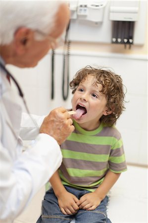 physician with older male - Doctor examining boy in office Stock Photo - Premium Royalty-Free, Code: 649-05950080