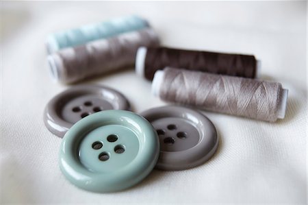 simsearch:614-08869875,k - Close up of buttons and spools of thread Stock Photo - Premium Royalty-Free, Code: 649-05950265