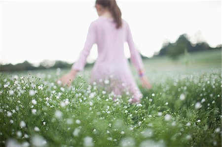 ponytail back view - Girl walking in field of flowers Stock Photo - Premium Royalty-Free, Code: 649-05950471