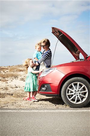 people with broken down cars - Family sitting by broken down car Stock Photo - Premium Royalty-Free, Code: 649-05950801