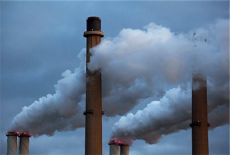 power plant - Smoke pouring from factory smokestacks Stock Photo - Premium Royalty-Free, Code: 649-05950810