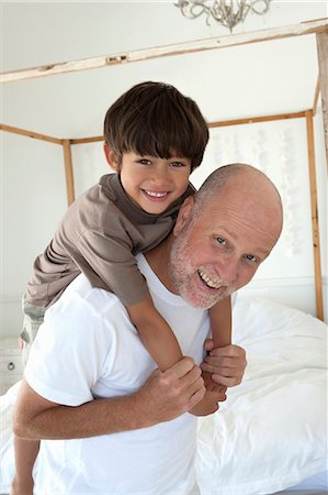 simsearch:649-05657173,k - Father carrying son piggyback Stock Photo - Premium Royalty-Free, Code: 649-06000395