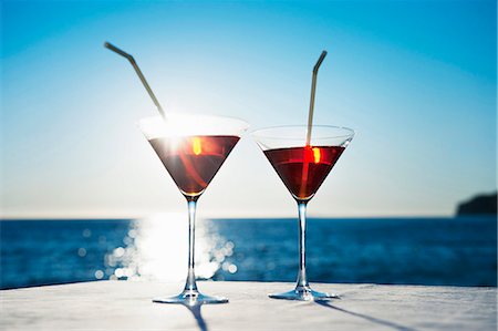 summer time sky - Martinis with straws on table outdoors Stock Photo - Premium Royalty-Free, Code: 649-06000398