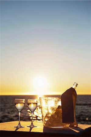 sunset summer food - Wine glasses and bottle outdoors Stock Photo - Premium Royalty-Free, Code: 649-06000399