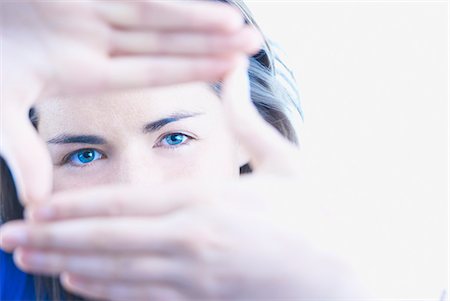 Woman making viewfinder with hands Stock Photo - Premium Royalty-Free, Code: 649-06000756