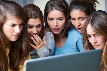 scared woman - Shocked women using laptop together Stock Photo - Premium Royalty-Free, Code: 649-06000781