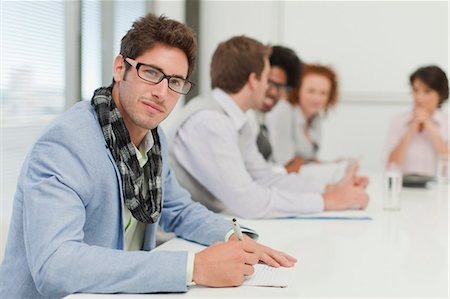 simsearch:614-03981680,k - Businessman making notes in meeting Stock Photo - Premium Royalty-Free, Code: 649-06000858