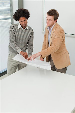 simsearch:649-06000806,k - Businessmen examining blueprints Stock Photo - Premium Royalty-Free, Code: 649-06000893