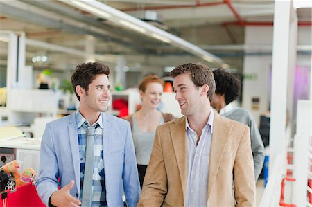 Businessmen walking together in office Stock Photo - Premium Royalty-Free, Code: 649-06000926