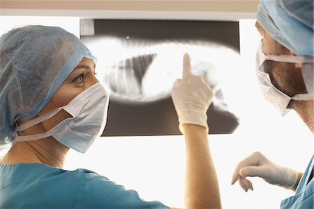 female surgeons at work - Veterinarians examining x-rays in office Stock Photo - Premium Royalty-Free, Code: 649-06001008