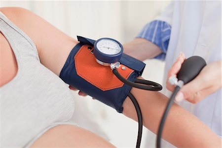 registered nurse - Doctor taking womans blood pressure Stock Photo - Premium Royalty-Free, Code: 649-06001100