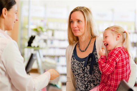 service store communication - Pharmacist talking to patients in store Stock Photo - Premium Royalty-Free, Code: 649-06001309