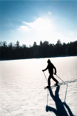 silhouette fun active - Cross country skier on snowy field Stock Photo - Premium Royalty-Free, Code: 649-06001341