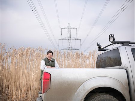 Farmer with truck in elephant grass Stock Photo - Premium Royalty-Free, Code: 649-06001457