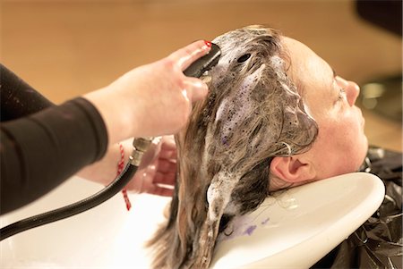 simsearch:649-04249188,k - Hair stylist washing clients hair Stock Photo - Premium Royalty-Free, Code: 649-06001834