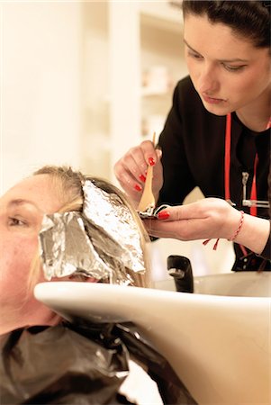 dead mature woman - Hair stylist coloring clients hair Stock Photo - Premium Royalty-Free, Code: 649-06001833