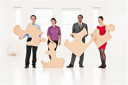 enigma - Business people holding puzzle pieces Foto de stock - Sin royalties Premium, Código: 649-06001891