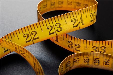 Close up of measuring tape Stock Photo - Premium Royalty-Free, Code: 649-06002007