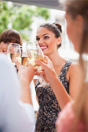 expensive woman - Friends toasting each other at party Stock Photo - Premium Royalty-Free, Code: 649-06040144