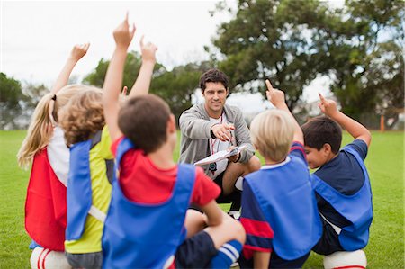 question and answer - Children raising hands during practice Stock Photo - Premium Royalty-Free, Code: 649-06040307