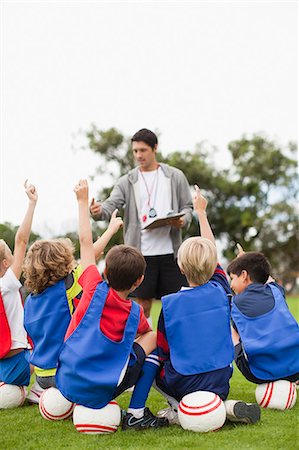 participating - Children raising hands during practice Stock Photo - Premium Royalty-Free, Code: 649-06040308