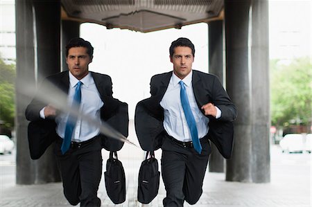 suit man at window - Businessman running on city street Stock Photo - Premium Royalty-Free, Code: 649-06040338