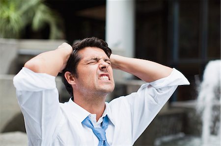 stressed african pictures - Businessman tearing at his hair Stock Photo - Premium Royalty-Free, Code: 649-06040343