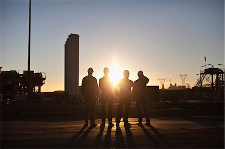 sunset sunrise - Silhouette of workers at oil refinery Stock Photo - Premium Royalty-Free, Code: 649-06040426