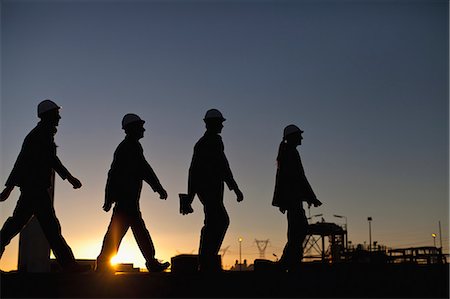 silhouette outdoor - Silhouette of workers at oil refinery Stock Photo - Premium Royalty-Free, Code: 649-06040428