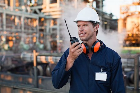 engineer efficiency - Worker using walkie talkie on site Stock Photo - Premium Royalty-Free, Code: 649-06040430