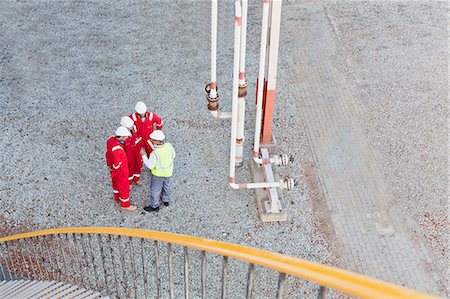 simsearch:649-06040355,k - Workers talking at chemical plant Stock Photo - Premium Royalty-Free, Code: 649-06040545