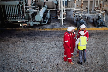 Workers talking at chemical plant Stock Photo - Premium Royalty-Free, Code: 649-06040547