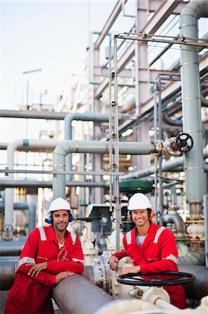 pipe oil - Workers talking at chemical plant Stock Photo - Premium Royalty-Free, Code: 649-06040560