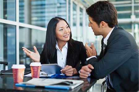 people at coffee shop with computers - Business people using tablet computer Stock Photo - Premium Royalty-Free, Code: 649-06040600