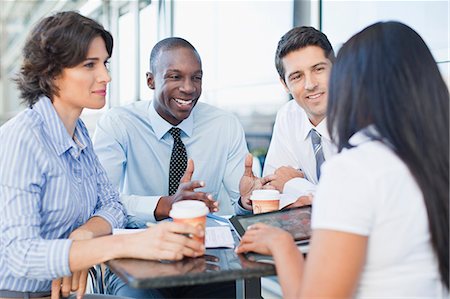 simsearch:649-06040618,k - Business people working together in cafe Stock Photo - Premium Royalty-Free, Code: 649-06040613