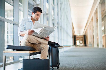 smart businessman - Businessman reading newspaper on bench Stock Photo - Premium Royalty-Free, Code: 649-06040648